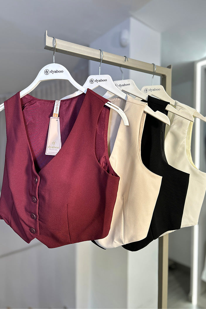 Chaleco DF04005 silueta ajustada para mujer, elaborado en poliéster dyaboo color vinotinto