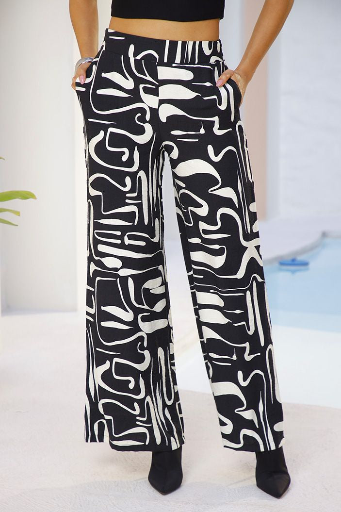 Pantalón DF06108 estampado silueta amplia para mujer. Elaborado en chalís. dyaboo negro 1