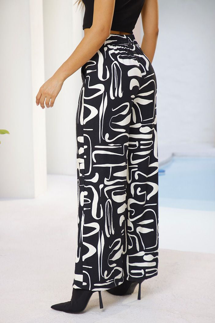 Pantalón DF06108 estampado silueta amplia para mujer. Elaborado en chalís. dyaboo negro 2